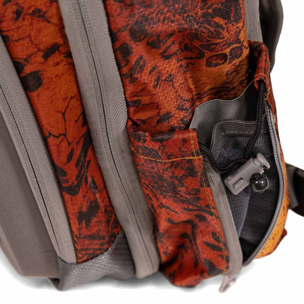 Side pocket image of the Fishtacker Riverpath Sling Pack in Firestorm.