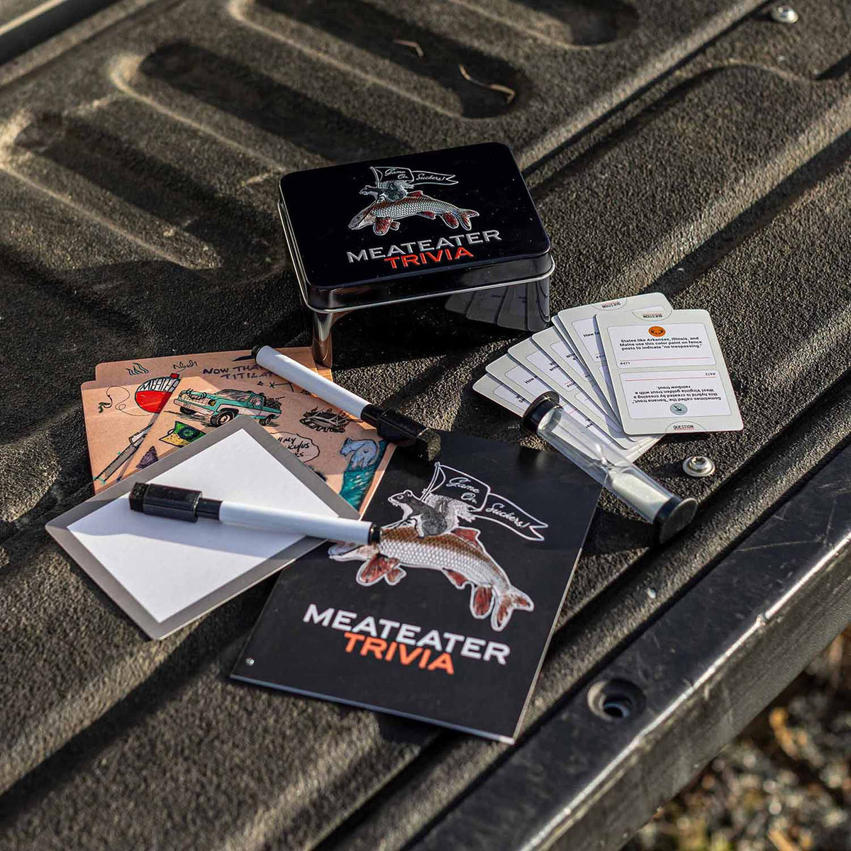 All pieces image of the MeatEater Trivia Board Game.