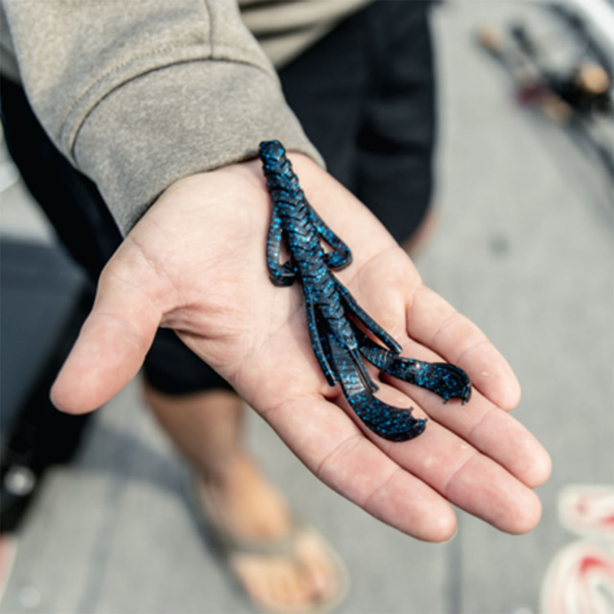 Strike King Rage Hawg Fishing Bait Size Comparison in Hand Image