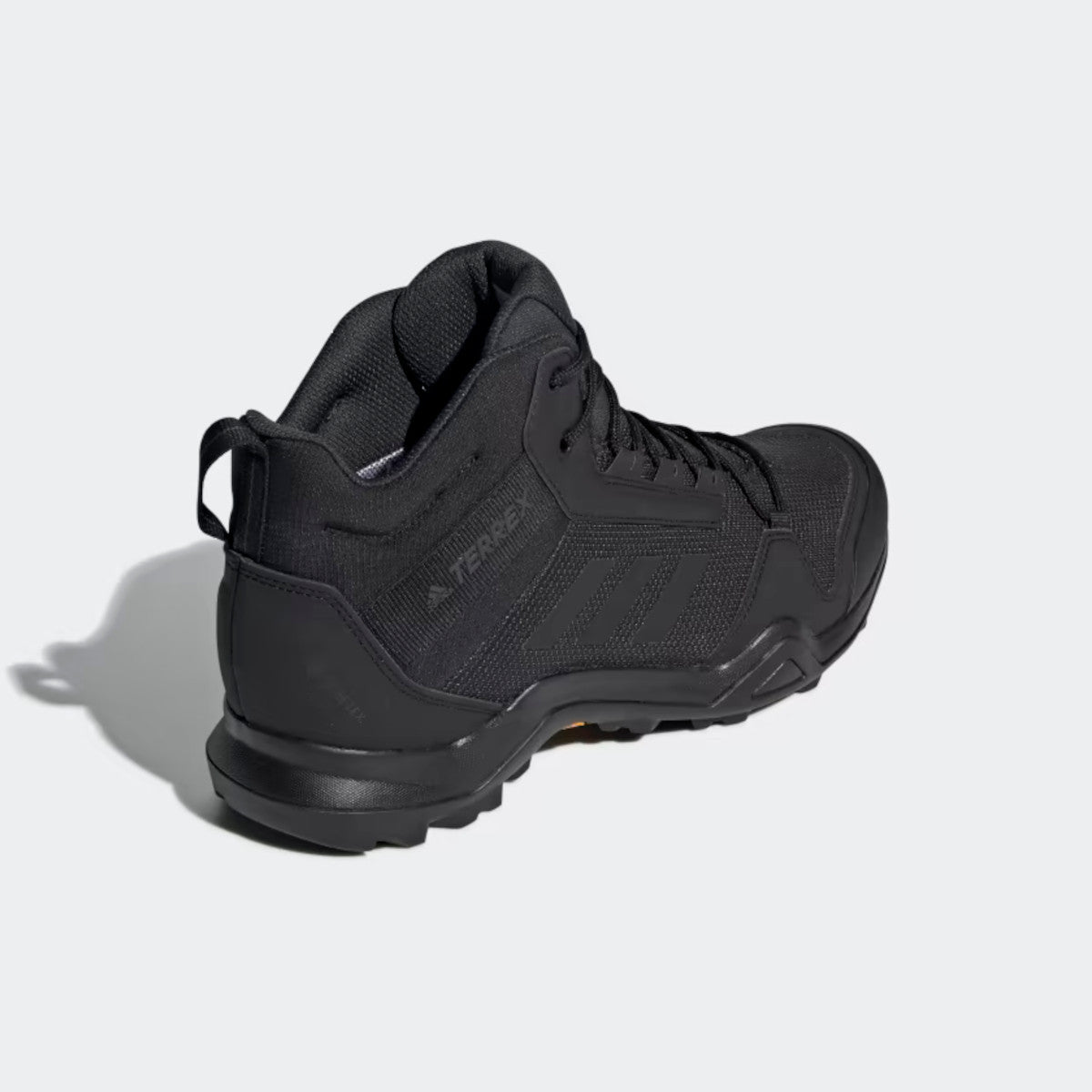 Back flipped image of the Adidas TERREX AX3 MID GTX-Black/Carbon