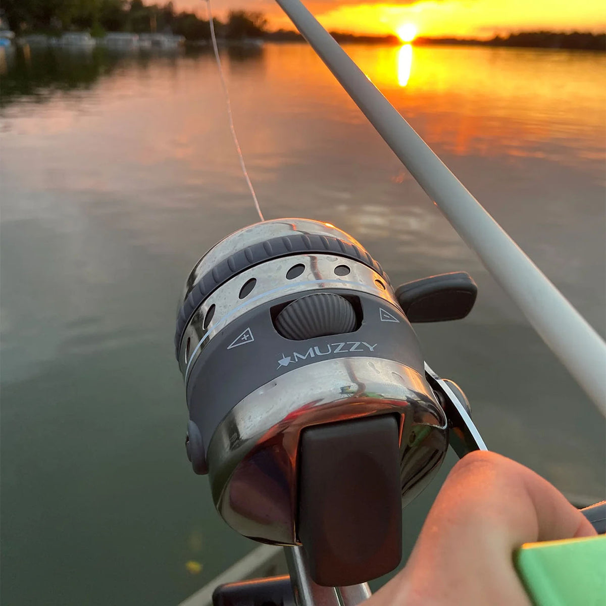 In use image of the Muzzy Bowfishing XD Spincast Reel.