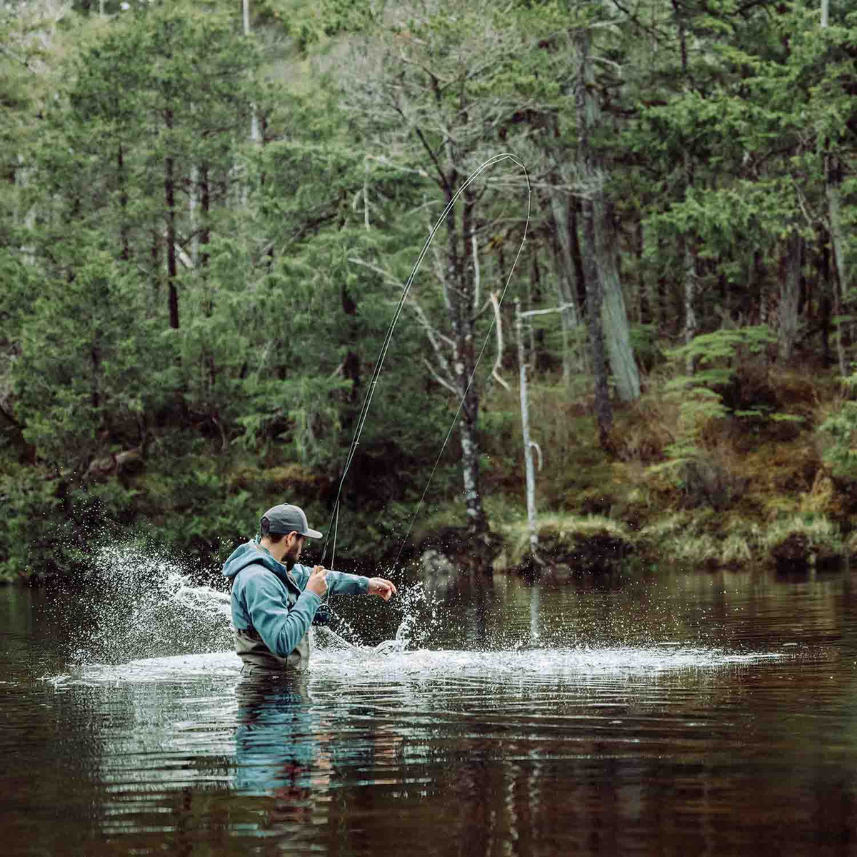 Lifestyle Image of the Sitka CrossCurrent Zip GTX Stockingfoot Wader.