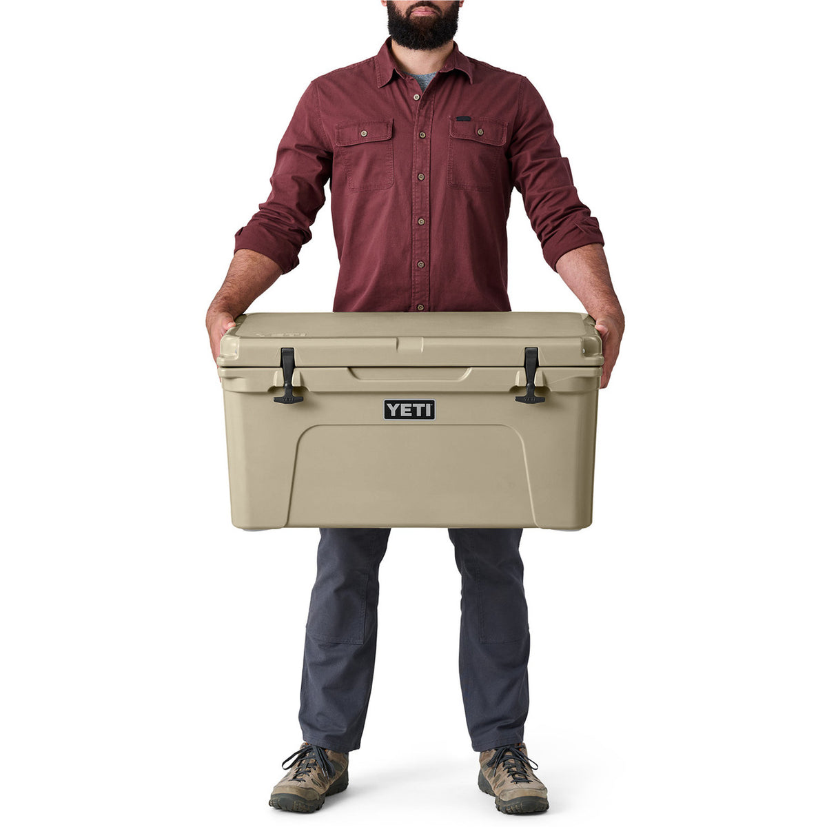 Model Holding the Cooler Image of the Yeti Tundra 65 Hard-Sided Cooler.